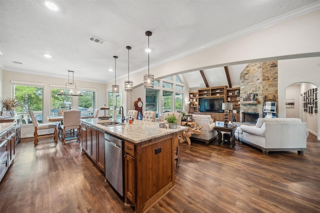 kitchen with dishwasher, dark wood finished floors, a sink, and visible vents