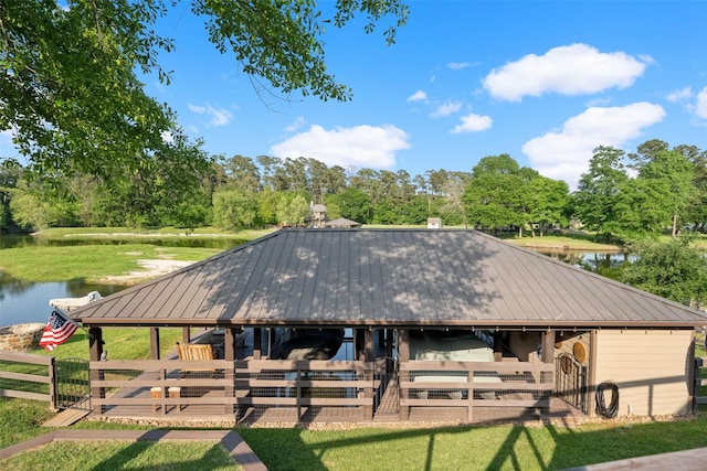 view of horse barn featuring a water view