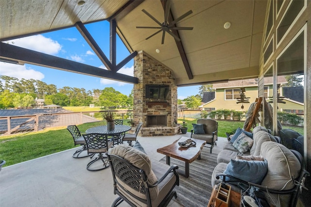 view of patio with an outdoor living space with a fireplace, a ceiling fan, and fence