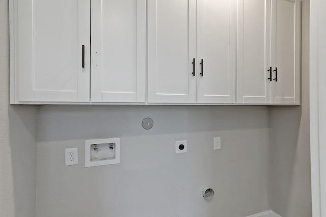 washroom featuring cabinet space, washer hookup, gas dryer hookup, and hookup for an electric dryer