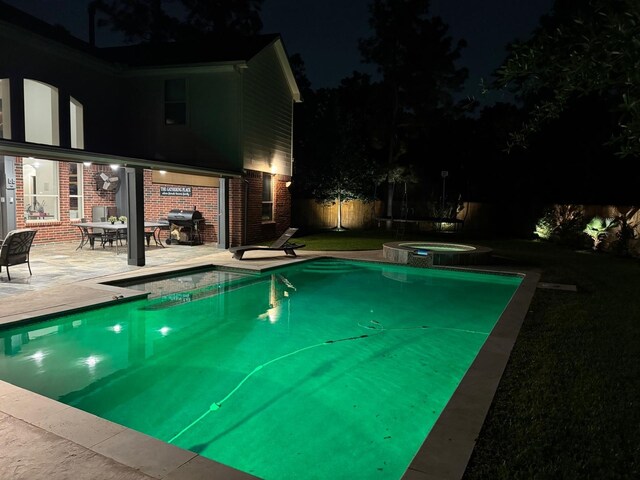 pool at twilight featuring a patio, fence, a grill, and a pool with connected hot tub