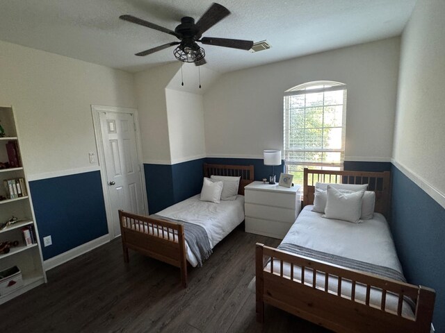 bedroom with dark wood-type flooring and ceiling fan