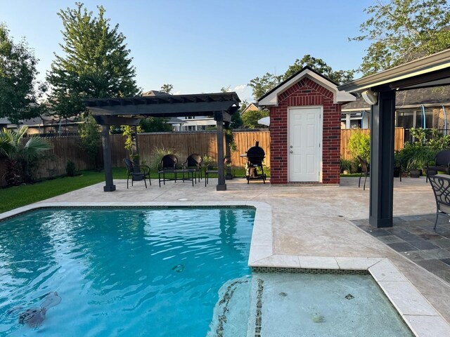 view of pool featuring a patio, a pergola, a fenced backyard, and grilling area