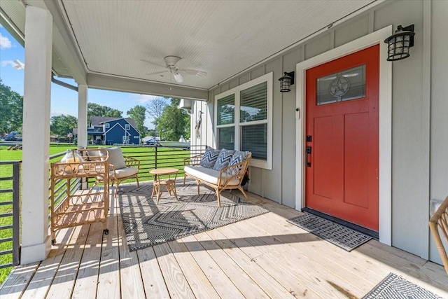 wooden deck with ceiling fan and covered porch