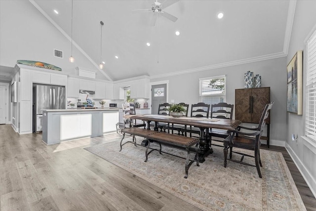 dining space with recessed lighting, light wood finished floors, visible vents, high vaulted ceiling, and ceiling fan