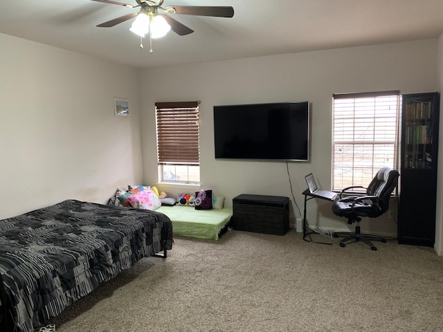 bedroom with ceiling fan and carpet floors
