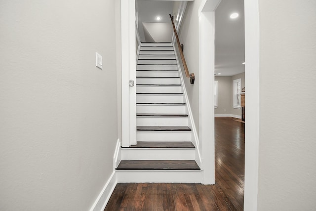 3013 Prospect St, Houston, TX 77004 - stairway featuring baseboards, wood finished floors, and recessed lighting