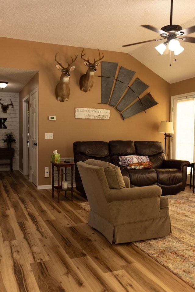 1867 Fm 2423, Grapeland, TX 75844 - living area with vaulted ceiling, wood finished floors, a textured ceiling, and ceiling fan