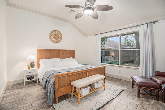2884 Shallow Brook Ln, Dickinson, TX 77539 - bedroom with vaulted ceiling, ornamental molding, light wood-style flooring, baseboards, and a ceiling fan