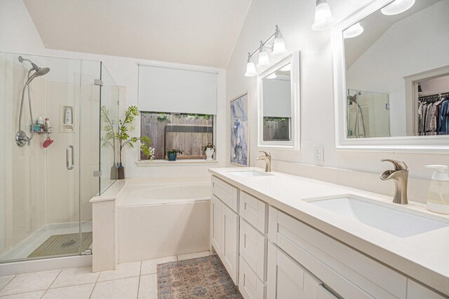 2884 Shallow Brook Ln, Dickinson, TX 77539 - full bath with a stall shower, tile patterned flooring, a garden tub, double vanity, and lofted ceiling