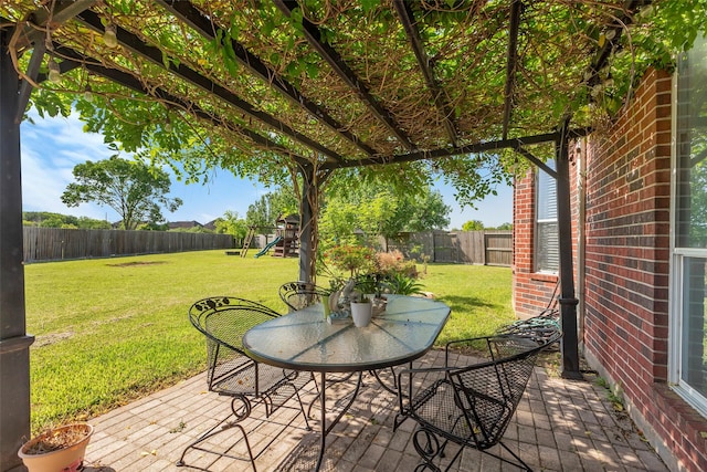 6919 S Gold River Cir, Missouri City, TX 77459 - view of patio / terrace with a fenced backyard and a playground