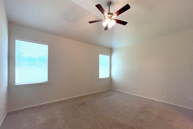 18871 Cedar Birch Ln, Magnolia, TX 77355 - spare room with light colored carpet, lofted ceiling, baseboards, and ceiling fan