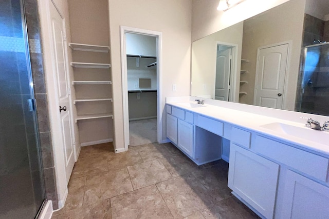 18871 Cedar Birch Ln, Magnolia, TX 77355 - bathroom featuring a shower stall, a walk in closet, double vanity, and tile patterned floors