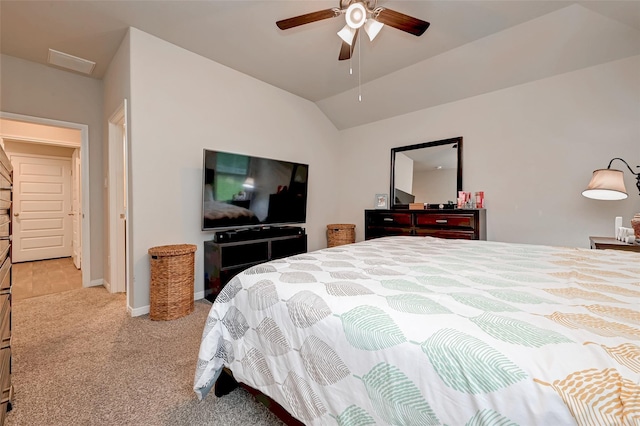 bedroom featuring ceiling fan, visible vents, baseboards, carpet floors, and vaulted ceiling