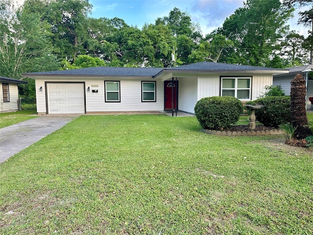 single story home with an attached garage, a front lawn, and driveway