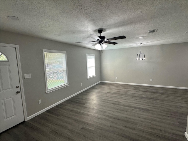 entryway featuring visible vents, a ceiling fan, dark wood-type flooring, baseboards, and a textured ceiling