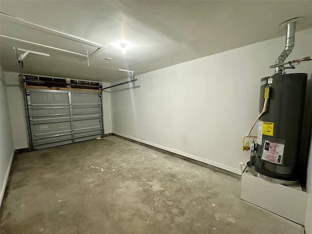 garage featuring water heater and baseboards