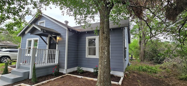 view of front of house featuring roof with shingles