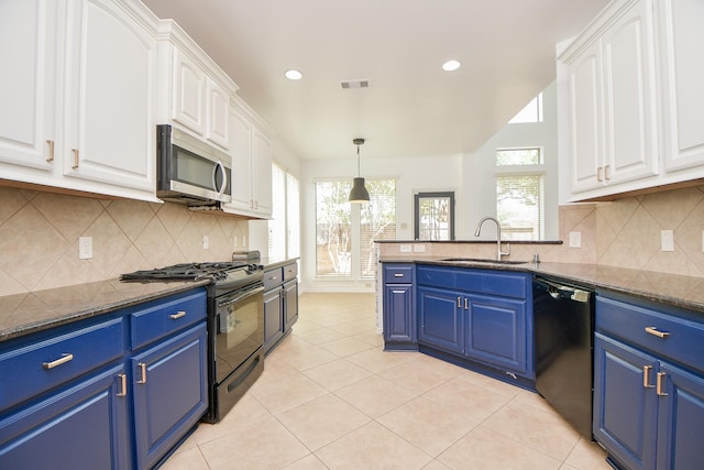 kitchen with a sink, stainless steel microwave, gas stove, dishwashing machine, and blue cabinetry