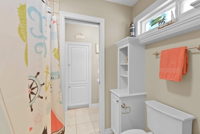 1207 N Shore Dr, Clear Lake Shores, TX 77565 - full bathroom with tile patterned flooring, toilet, and curtained shower