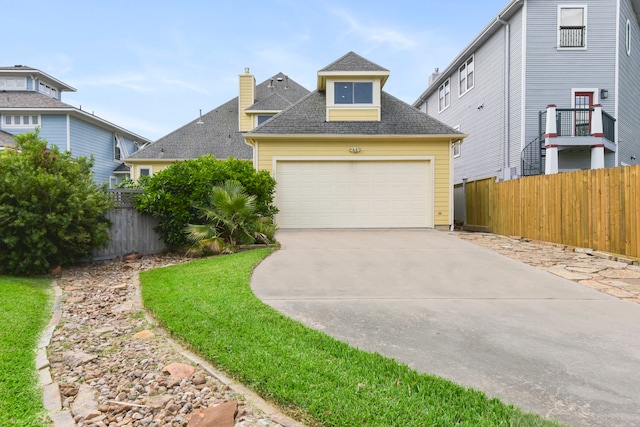 1207 N Shore Dr, Clear Lake Shores, TX 77565 - traditional home featuring roof with shingles and driveway