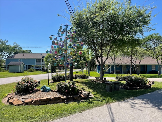 1207 N Shore Dr, Clear Lake Shores, TX 77565 - view of front of home featuring a front yard