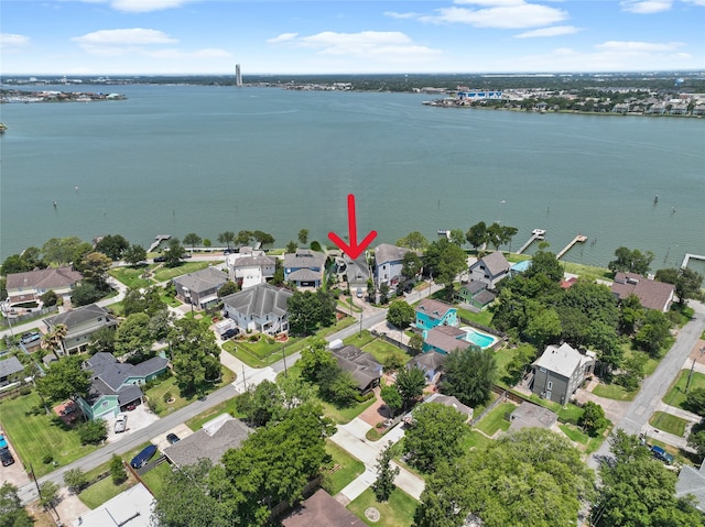 drone / aerial view with a residential view and a water view