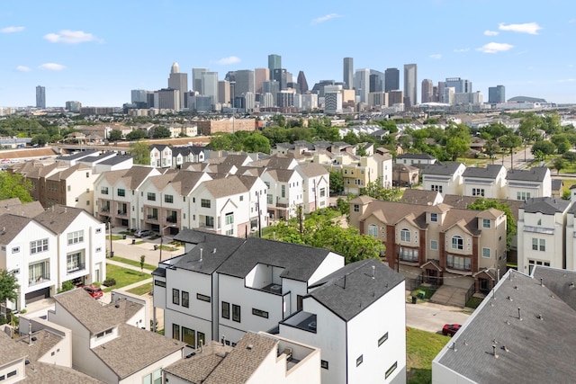 birds eye view of property with a view of city and a residential view