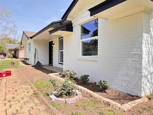 5 Skylark St, Dayton, TX 77535 - view of side of home featuring brick siding