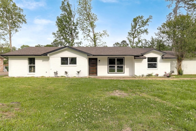5 Skylark St, Dayton, TX 77535 - ranch-style home with brick siding, a front yard, and roof with shingles