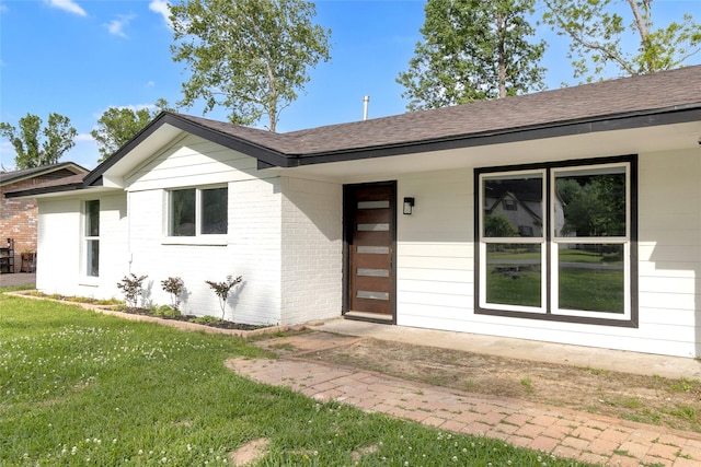 5 Skylark St, Dayton, TX 77535 - single story home with a front lawn, a shingled roof, and brick siding