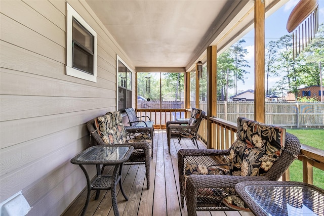 sunroom / solarium featuring an outdoor hangout area