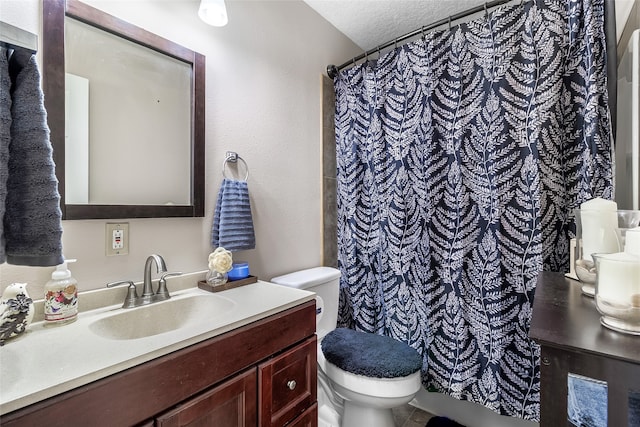 bathroom featuring toilet, vanity, and a shower with shower curtain