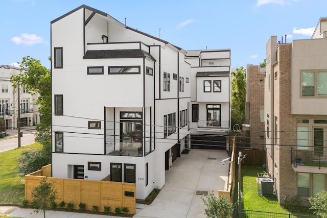 exterior space featuring fence and central air condition unit