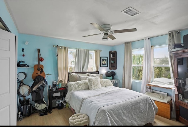 bedroom featuring wood finished floors and ceiling fan