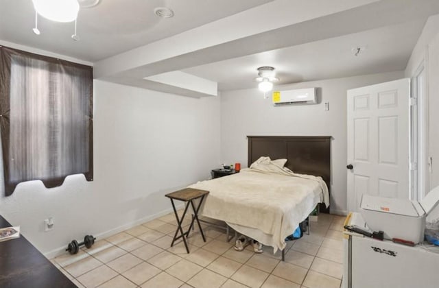 bedroom featuring a wall mounted air conditioner, light tile patterned floors, baseboards, and a ceiling fan
