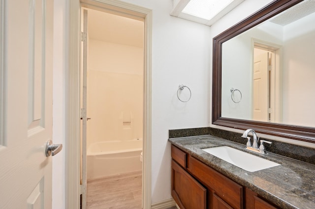 1823 Mandrill Ln, Houston, TX 77067 - bathroom featuring vanity, wood finished floors, and  shower combination