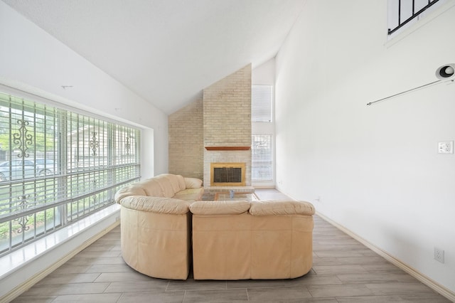 1823 Mandrill Ln, Houston, TX 77067 - living area with plenty of natural light, light wood finished floors, a brick fireplace, and high vaulted ceiling