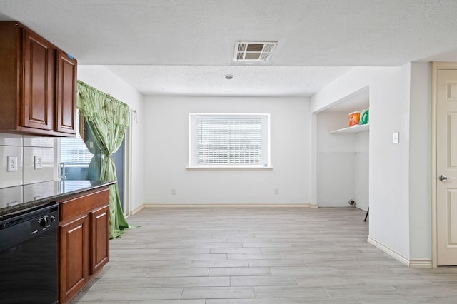 1823 Mandrill Ln, Houston, TX 77067 - kitchen with a textured ceiling, light wood-style floors, visible vents, and dishwasher
