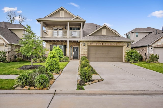 1706 Country Air Ln, Missouri City, TX 77459 - craftsman house featuring a balcony, a front lawn, driveway, stone siding, and a garage