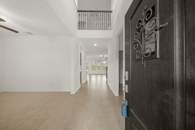 1706 Country Air Ln, Missouri City, TX 77459 - interior space featuring baseboards, visible vents, ceiling fan, crown molding, and light tile patterned floors
