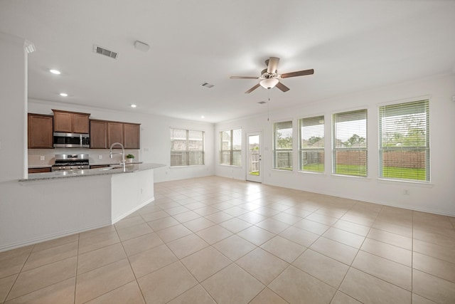 1706 Country Air Ln, Missouri City, TX 77459 - unfurnished living room featuring light tile patterned floors, visible vents, recessed lighting, and ceiling fan