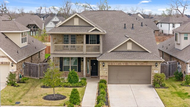 1706 Country Air Ln, Missouri City, TX 77459 - craftsman inspired home featuring fence, a shingled roof, and a balcony