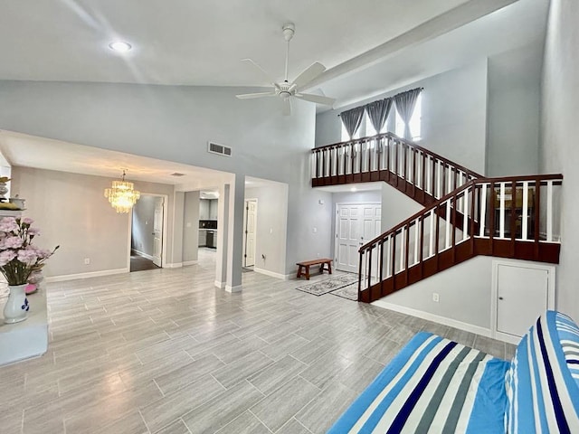 11115 Oakcenter Dr, Houston, TX 77072 - unfurnished living room with a chandelier, high vaulted ceiling, stairs, baseboards, and a ceiling fan