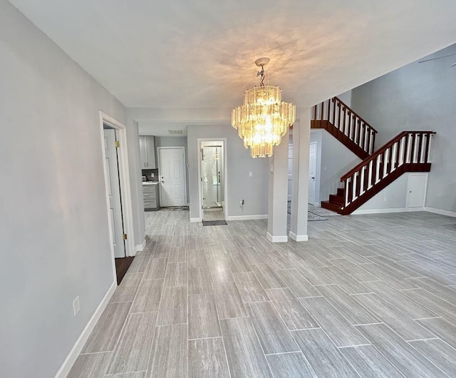 11115 Oakcenter Dr, Houston, TX 77072 - unfurnished dining area with stairs, a chandelier, baseboards, and light wood-type flooring