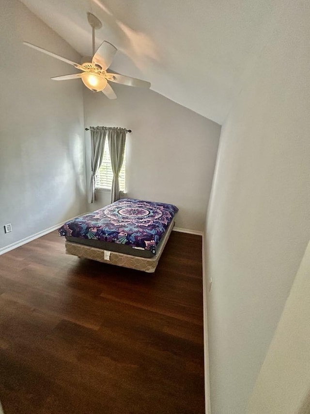 11115 Oakcenter Dr, Houston, TX 77072 - bedroom featuring vaulted ceiling, wood finished floors, baseboards, and a ceiling fan