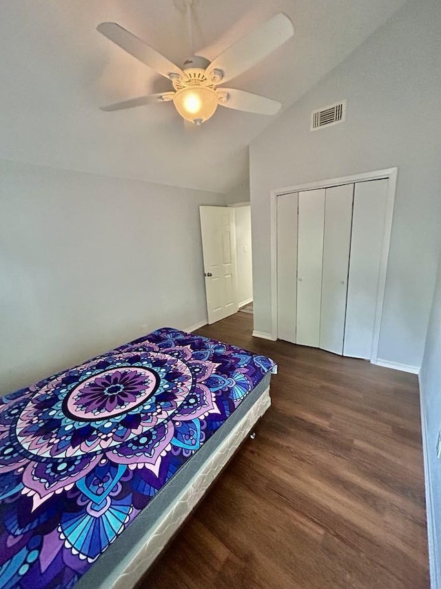 11115 Oakcenter Dr, Houston, TX 77072 - bedroom with lofted ceiling, dark wood-type flooring, a closet, ceiling fan, and baseboards