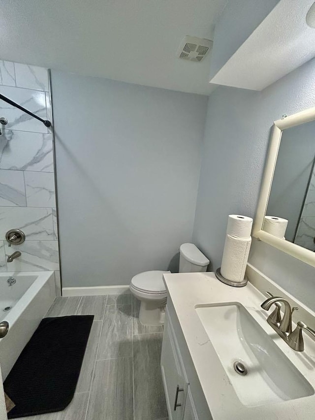 11115 Oakcenter Dr, Houston, TX 77072 - bathroom featuring toilet, vanity, tub / shower combination, and baseboards