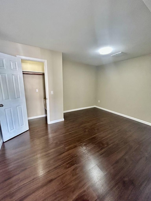 11115 Oakcenter Dr, Houston, TX 77072 - spare room featuring dark wood finished floors and baseboards