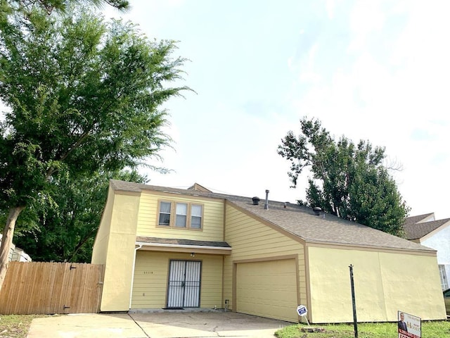 11115 Oakcenter Dr, Houston, TX 77072 - traditional-style home with a garage, concrete driveway, a gate, and a shingled roof
